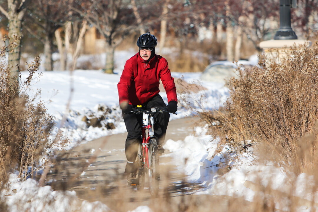 BOB EIERMAN COMMUTES TO HIS JOB AT UWEC ON A BICYCLE YEAR-ROUND – EVEN IN WINTER.