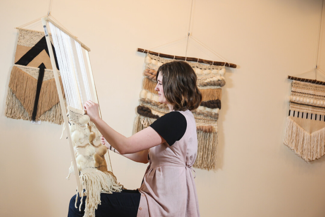 A LOOM WITH A VIEW. Heidi Haubrich works with several different mediums such as acrylic or wool yarn, wool roving (to add that puffy texture), raffia, and even plastic bags.