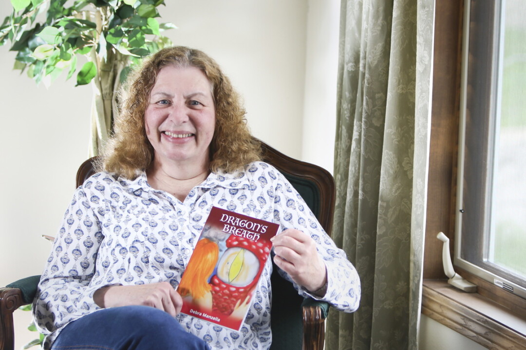 GRANDMOTHERLY TALES. Writer Debra Manzella says her grandchildren provide both inspiration and criticism for her fantasy books, which are written for readers in second through fourth grades.