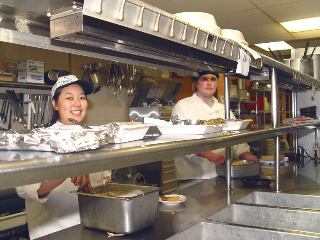 IF YOU CAN’T STAND THE HEAT, GET OUT OF THE KITCHEN. In this 2007 photo, students in Chippewa Valley Technical College’s now-defunct hospitality program work at the Valley Rose Cafe at CVTC. The college will soon revive its culinary arts program to train future food service professionals.