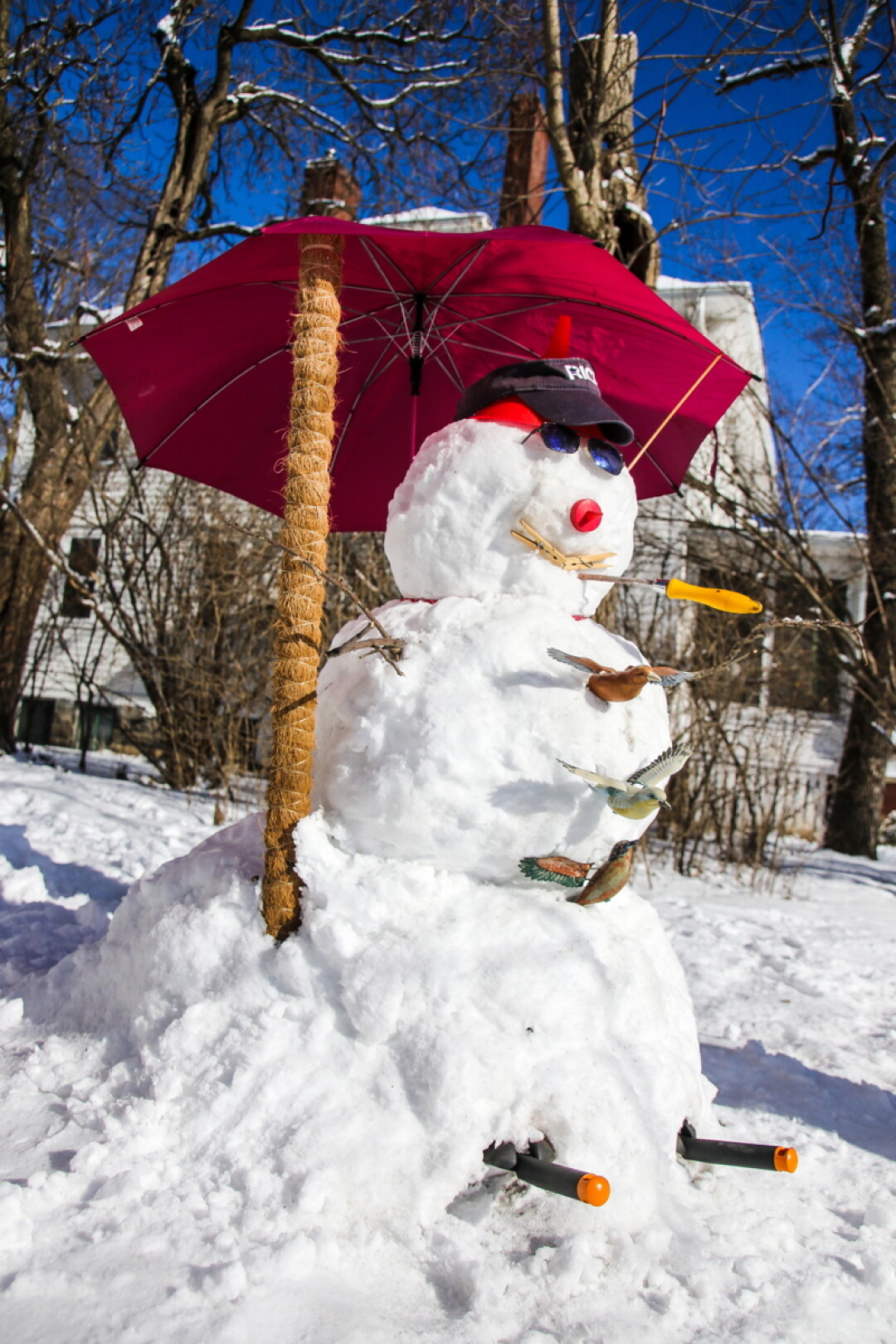 MADE IN THE SHADE. If the sun hasn’t been too cruel, you’ll still be able to find this delightful snowman on North Dewey Street in Eau Claire. Unexpected additions such as an umbrella and a small flock of birds really ramp up the whimsy on this guy.