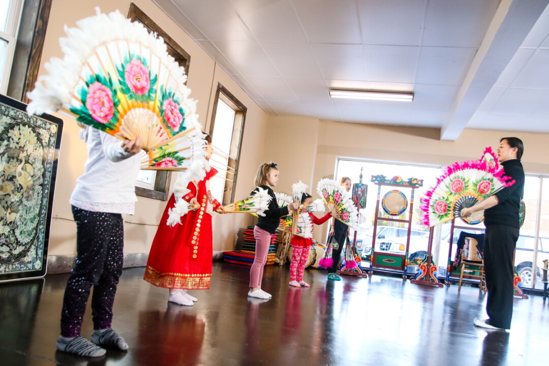 CULTURAL COLOR. Recently opened Kgam Studios in downtown Eau Claire offers Korean traditional, dance, drum, and folk art workshops. Above: Children practice a Korean dance.