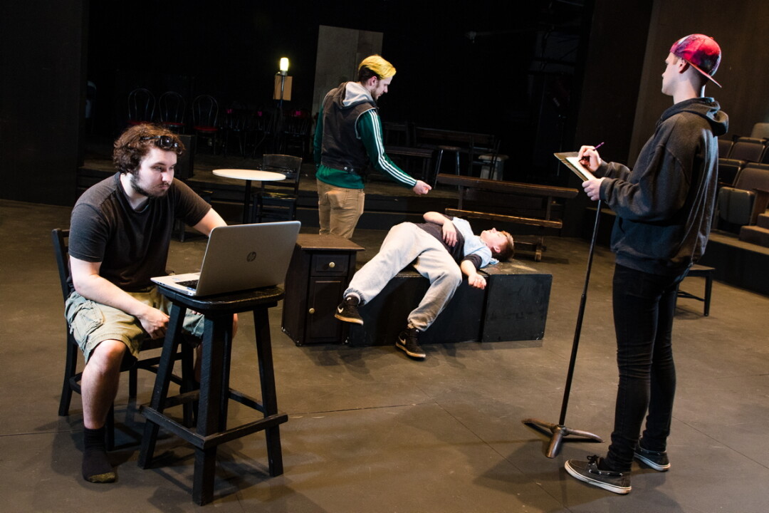 UWEC students (left to right) Zach Staads, Mitchell Marten, Darby Hand, and Barry Inman rehearse a new, original theatrical work. 