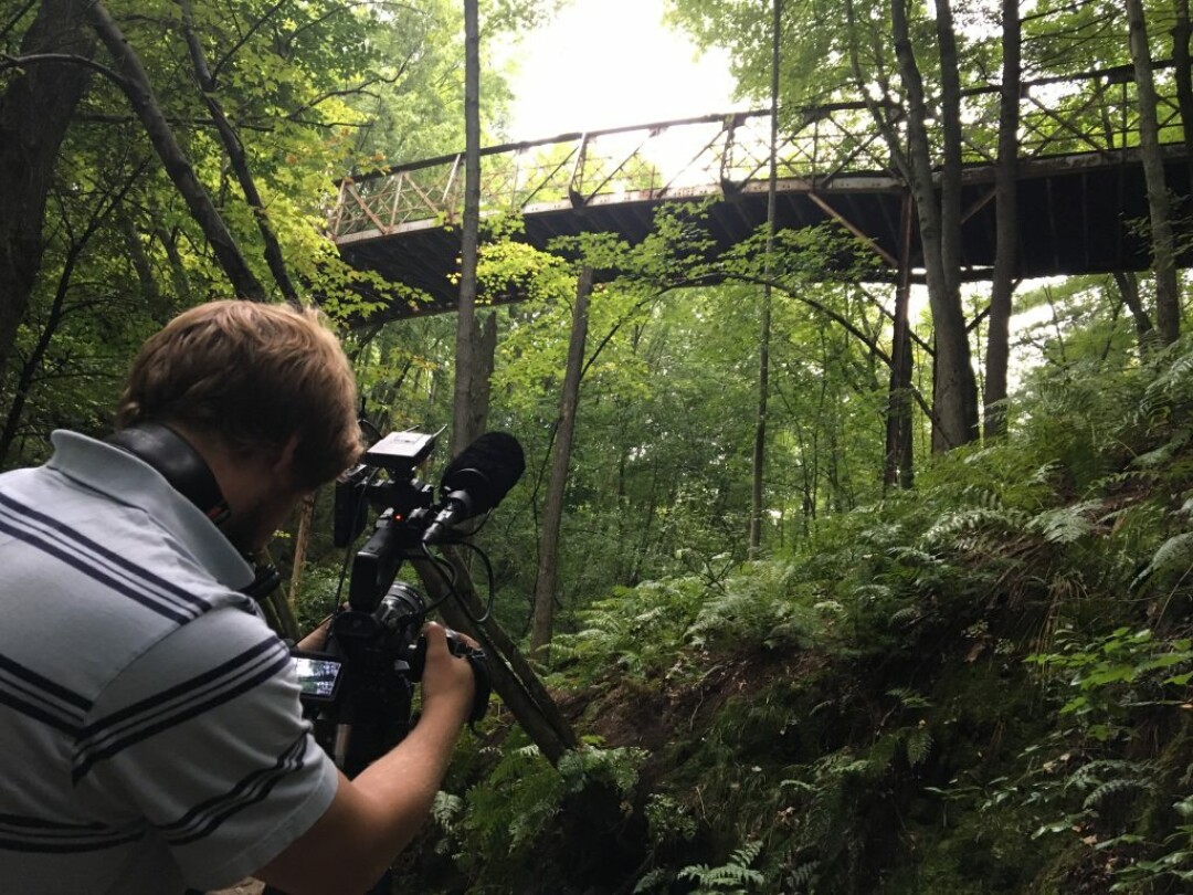 Videographer James films the historic Rumble Bridge at Irvine Park in Chippewa Falls. (Image: Discover Wisconsin)