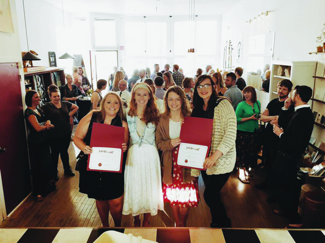 WISHES GRANTED. Becca Cooke (center left), owner of Red’s Mercantile and facilitator of the Red Letter Grant, presents the spring 2017 winners, Melnaturel LLC (left) and Odd Brand Strategy (right). Each startup was awarded $2,000.