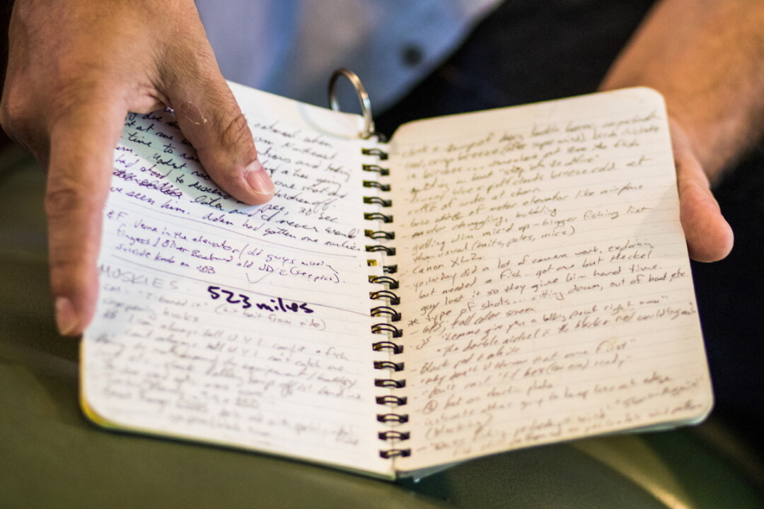 Perry displays a weather-proof notebook used for many of his freelance assignments.