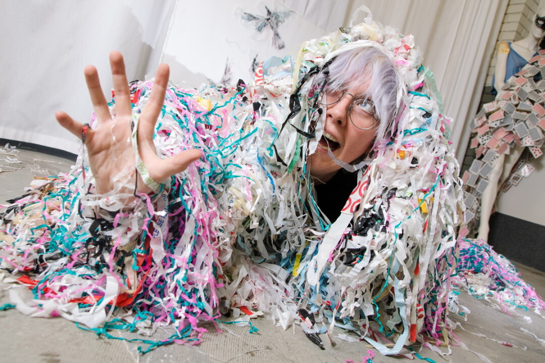 PORTRAIT OF THE ARTIST STRUNG OUT. Eau Claire-based artist CV Peterson, whose work ranges from painting to performance, deals largely in plastic scraps.