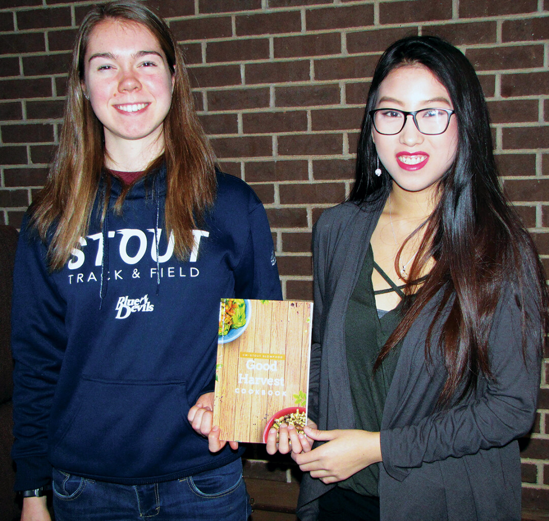 SLOWLY REVOLUTIONIZING FOOD. Cookbook project leads Lauren Mickley, left, and Choua Xiong said they learned a great deal from the area farmers interviewed for the cookbook.