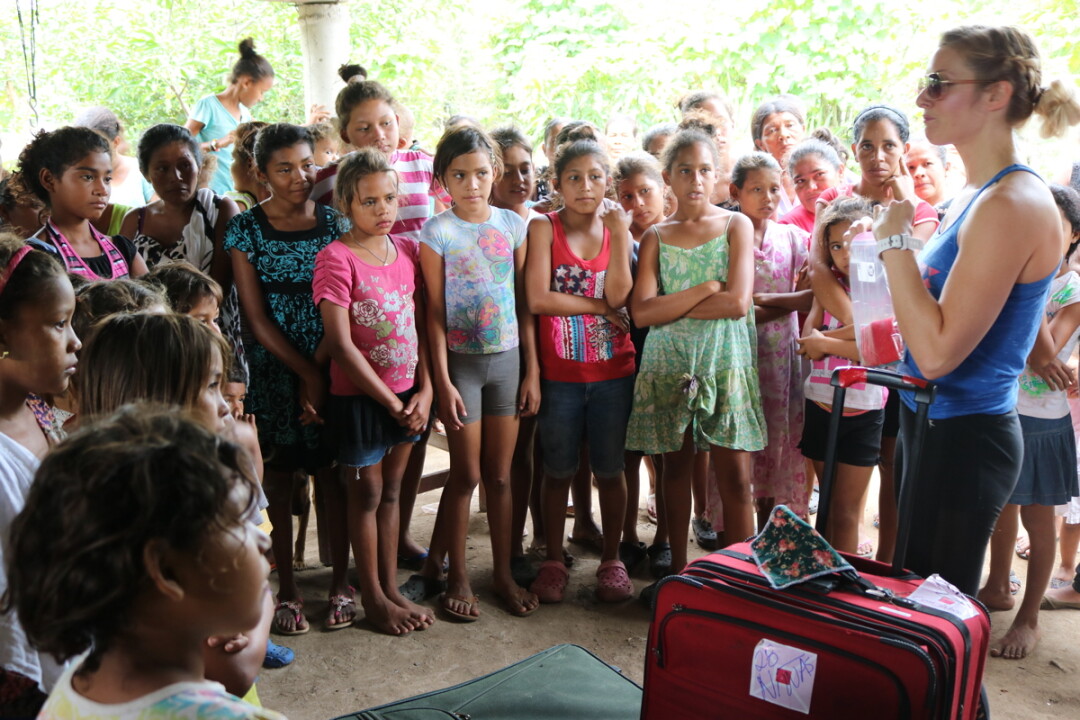 Heather Wittig instructs a group of Honduran girls in feminine hygiene and self-worth during a mission trip for Pink Box Purpose.