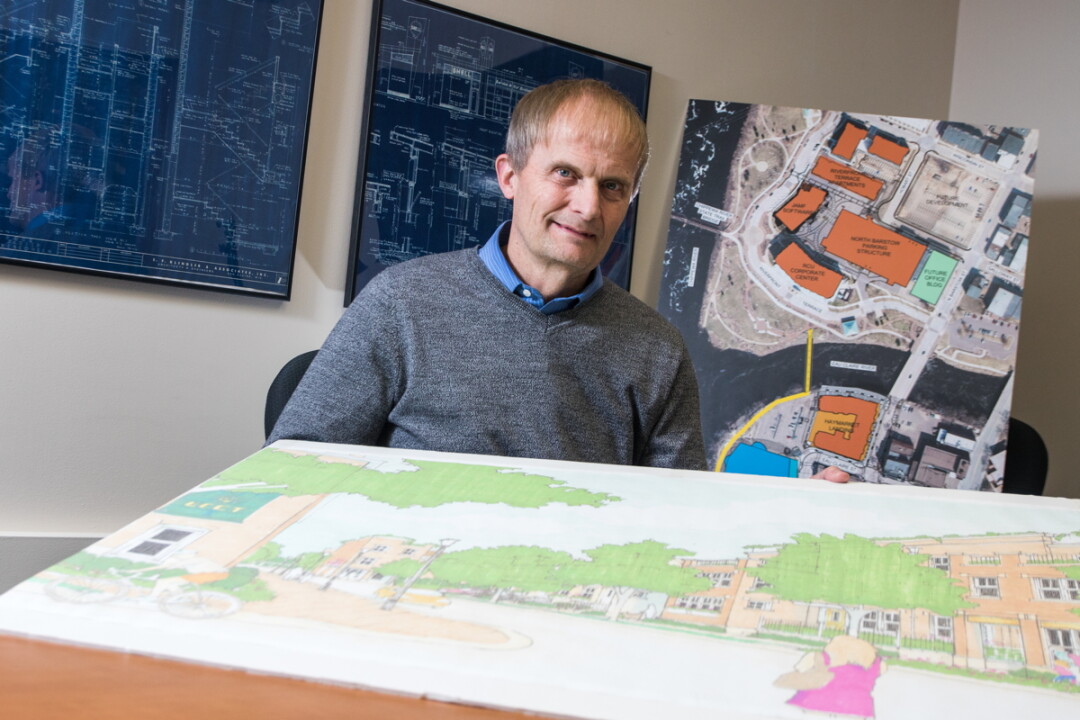 MAN WITH THE MAPS. Darryl Tufte retired March 1 after 33 years with the city of Eau Claire, first as city planner and then as community development director.