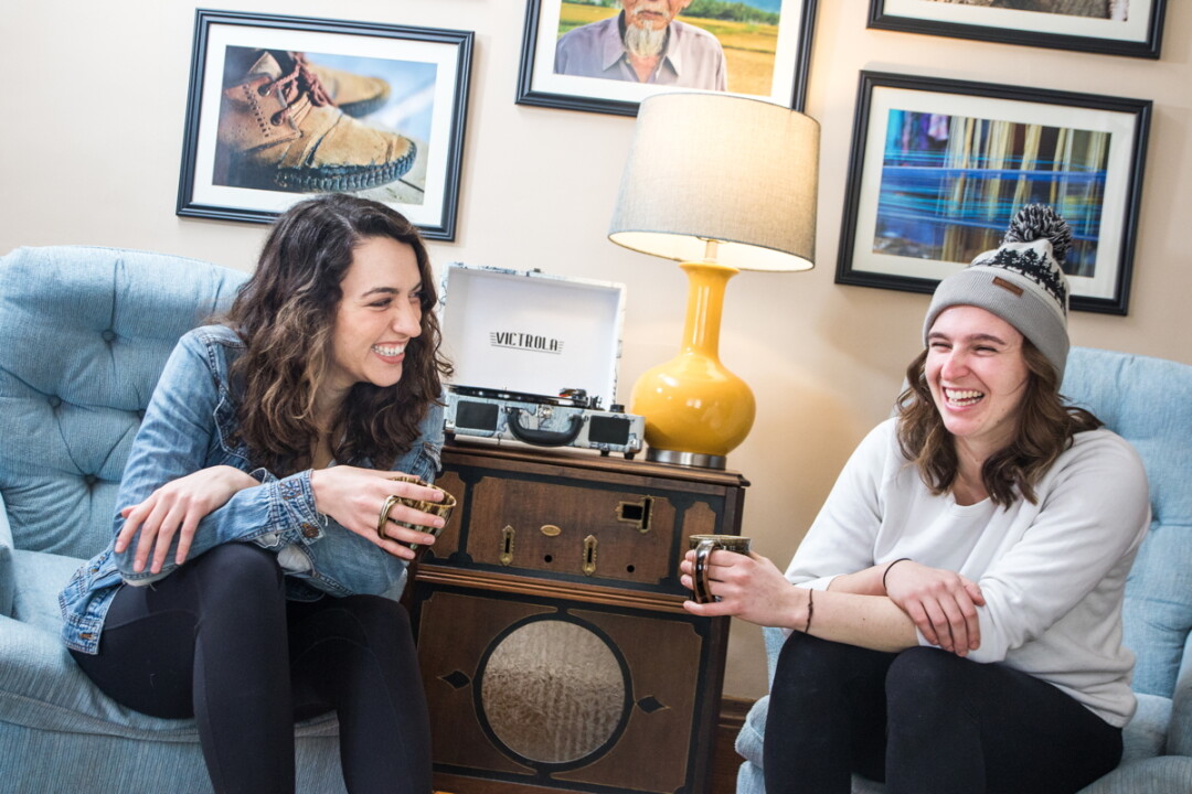 SIPS AND SMILES. Musical friends Cate Lucas (left) and Kelsey Nocek are Red Tide. The folk duo met while attending UW-Stevens Point and played their first show on a whim. Their debut album is out now. 