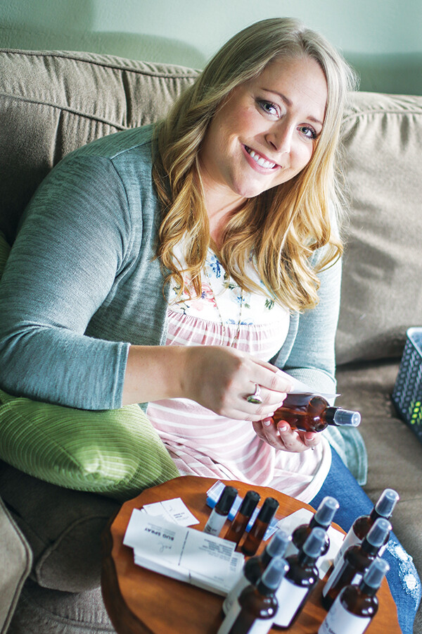 BOTTLE ROCKET. Melissa Wilson bottles and labels her line of Melnaturel bodycare products at home in Eau Claire. 