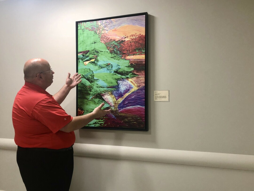 THEY’VE BEEN FRAMED! Regional Communications Director Matt Schneider talks about the local art at The New Marshfield Medical Center-Eau Claire Hospital, including this piece by Tom Gardner of Eau Claire.