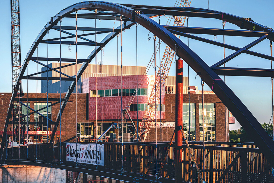 SPAN OF STEEL. The new pedestrian bridge connecting Phoenix Park to Haymarket Plaza was installed in early July. It was built by Anderson Bridges of Colfax.