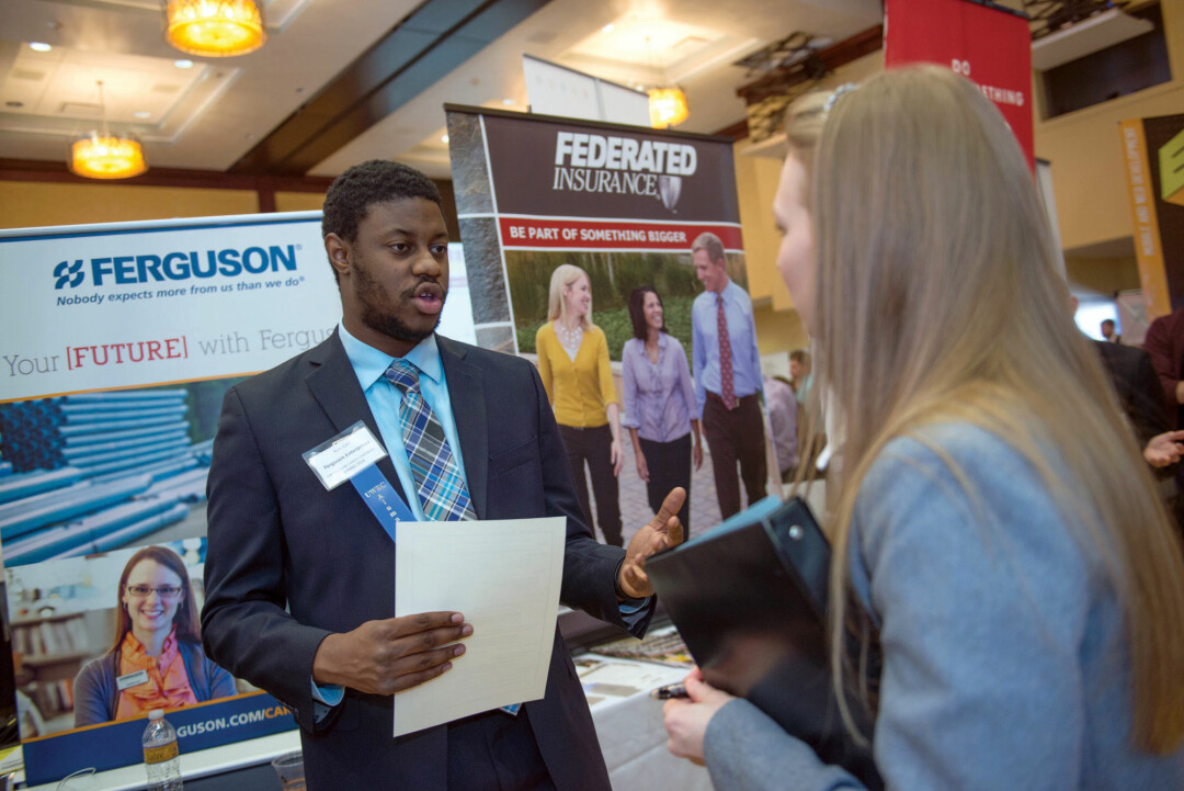 OPPORTUNITY KNOCKS. UW-Eau Claire students and recruiters mingle at a career conference. A new program aims to connect more students with local internships.