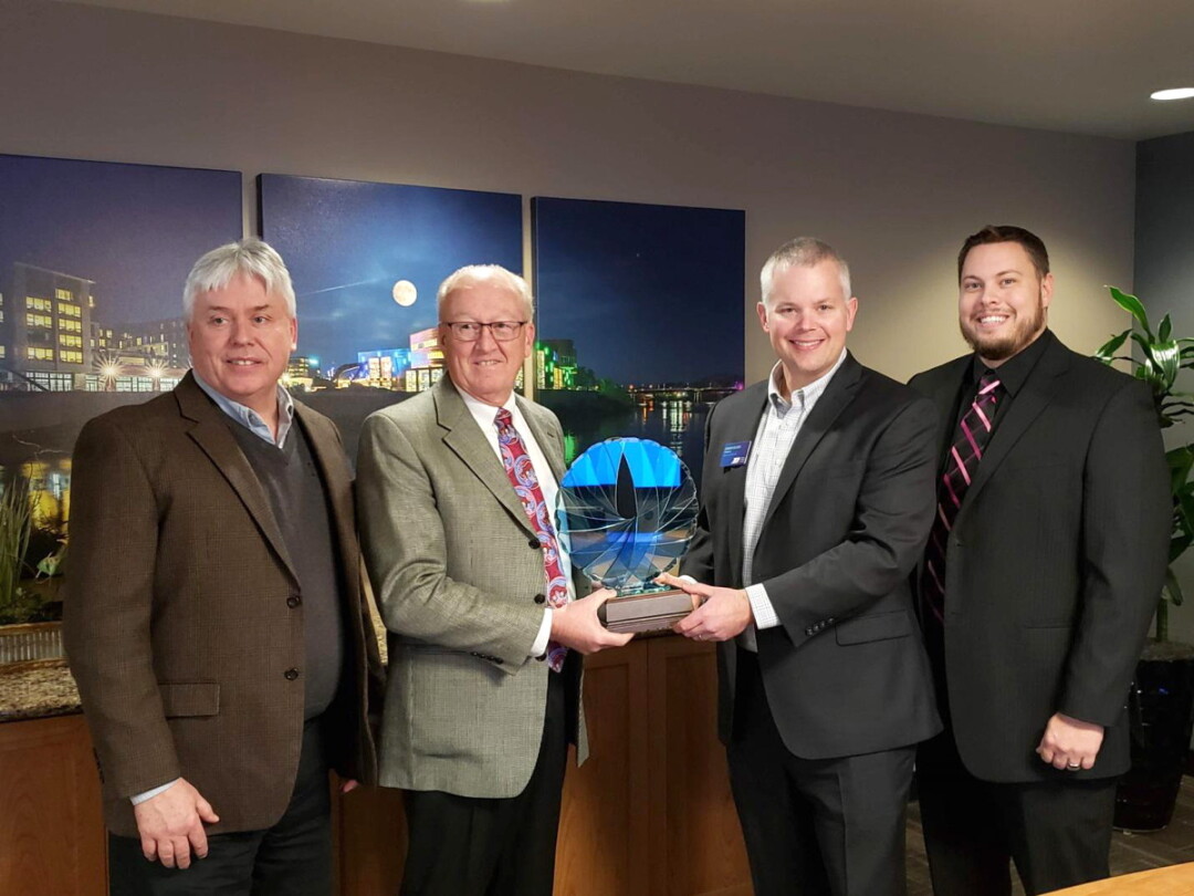 market & johnson received the paragon award from the eau claire area economic development corp. earlier this month. from left to right: M&J president jerry shea, M&J ceo dan market, RCU president and ceo brandon riechers, and eau claire area edc executive director luke hanson.