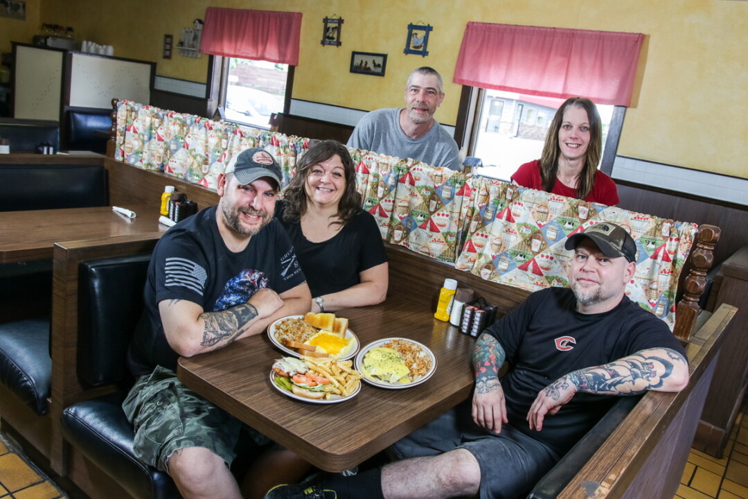 A DEDICATED CREW.  From left to right: New owners Brent and Dawn Knutson, utility man Kevin Kollwitz, server Marie Gunderson, and cook Mike Peterson.