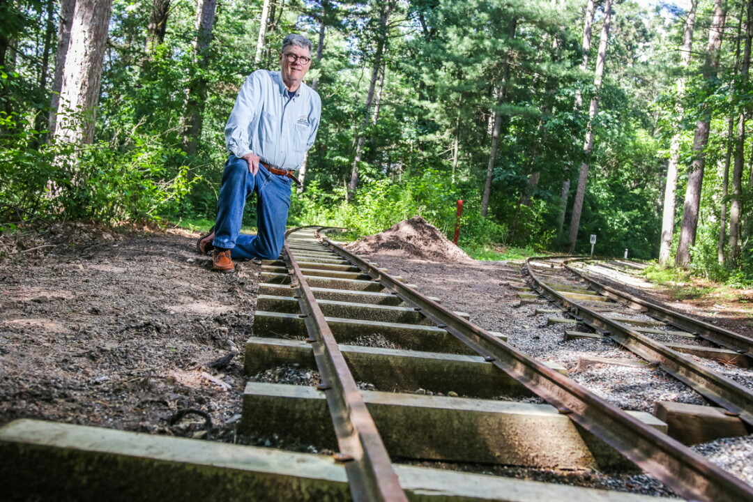 David Peterson of the Chippewa Valley Railroad Association poses with new track being added in Carson Park.