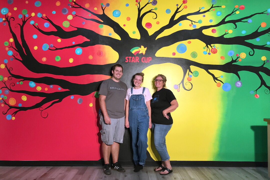 Artist Jessa Dressel,  center, with her brother Tyler and mother Becky.