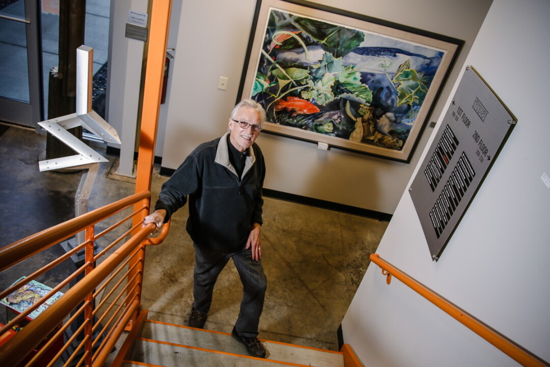 ART-A-GO-GO. Sculptor Bilhenry Walker has curated a lending library of artwork at Artisan Forge, which includes the painting in the background, “Aquarium Abstract II” by Milwaukee artist Diane Balsley.