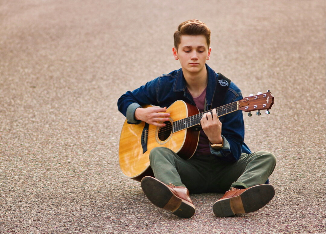 BUSKING FOR A CHAIR? Memorial High School student Spencer Rhoten recently released a pop/acoustic EP, Princess Charming, under the stage name Spencer Douglas. He’s also a member of the Kids From Wisconsin.