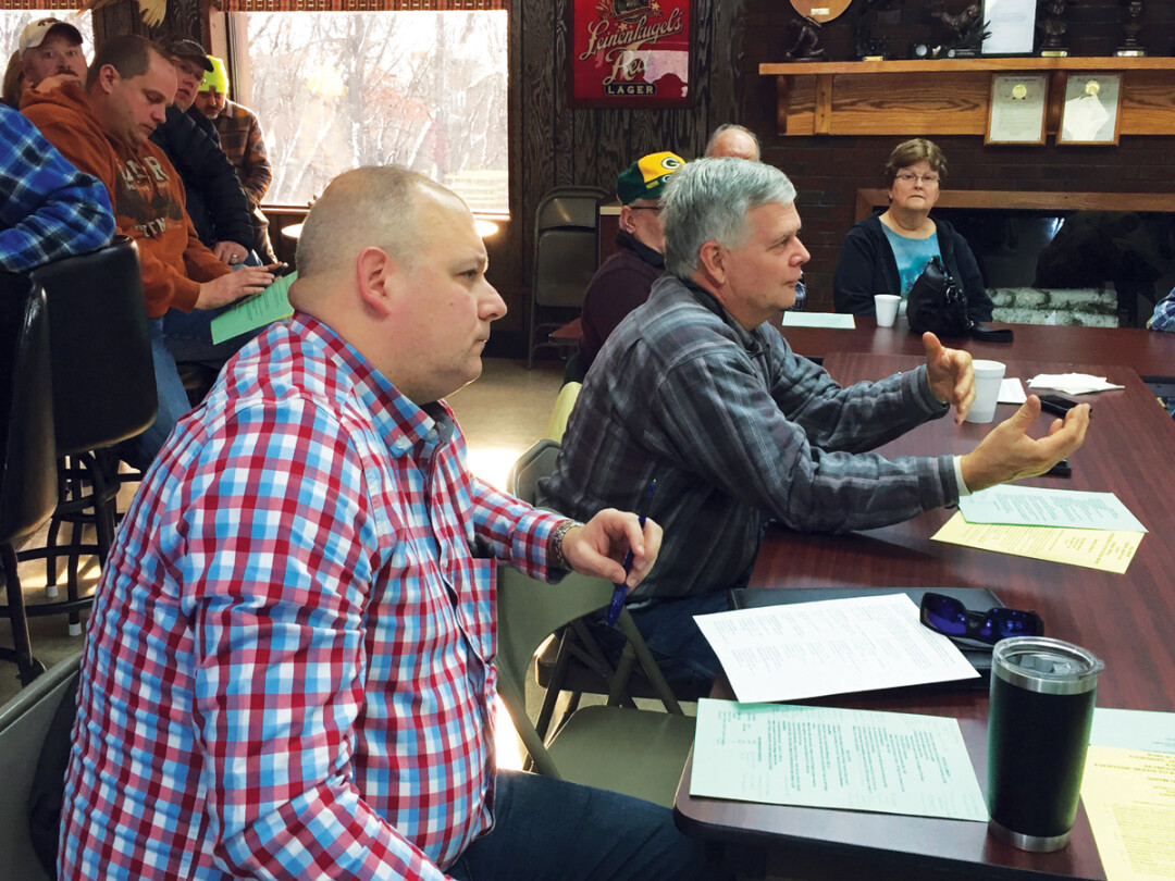 State Rep. Jesse James, R-Altoona, left, and state Sen. Jeff Smith, D-town of Brunswick, right, attended a Dec. 7 meeting of more then 70 residents discussing a proposed expansion of Seven Mike Creek Landfill in the town of Seymour.