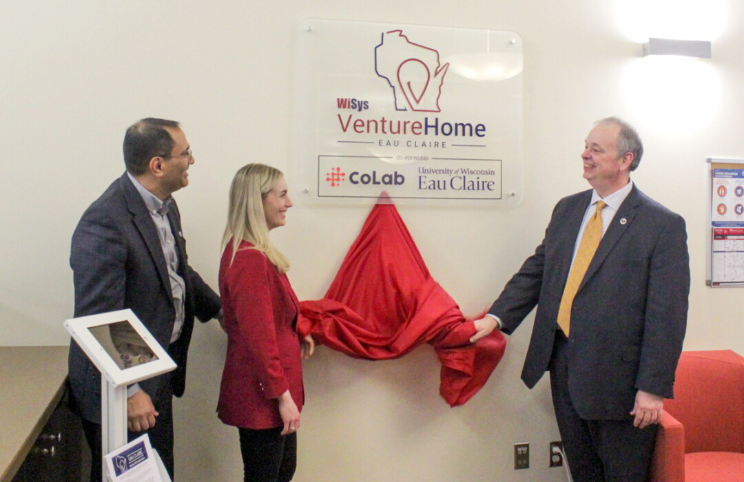 OPPORTUNITY UNVEILED. WiSys President Arjun Sanga, CoLab’s Elaine Couglin, and UW-Eau Claire Chancellor James Schmidt at the opening of the WiSys Venture home at Colab in downtown Eau Claire.