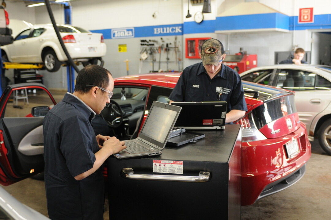 KEYED UP FOR LEARNING. Students (above) work in CVTC’s Automotive Maintenance Technician program, which would be part of a new Transportation Education Center (left), if a April 7 referendum is approved.