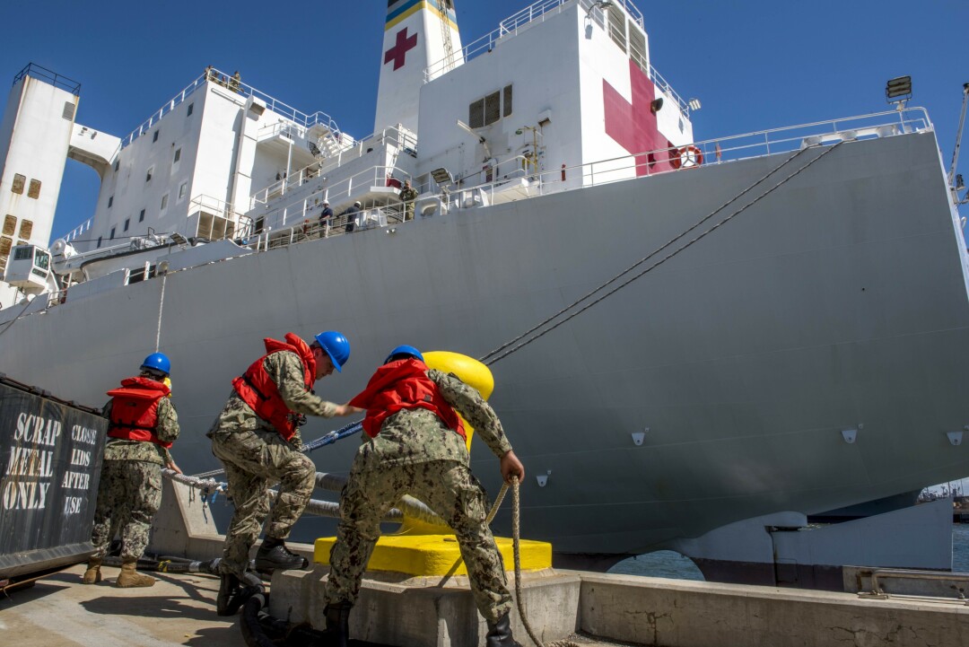 U.S. Navy sailors removed the lines as the hospital ship USNS Mercy prepared to depart Naval Base San Diego for Los Angeles on March 23. (Source: U.S. Navy)