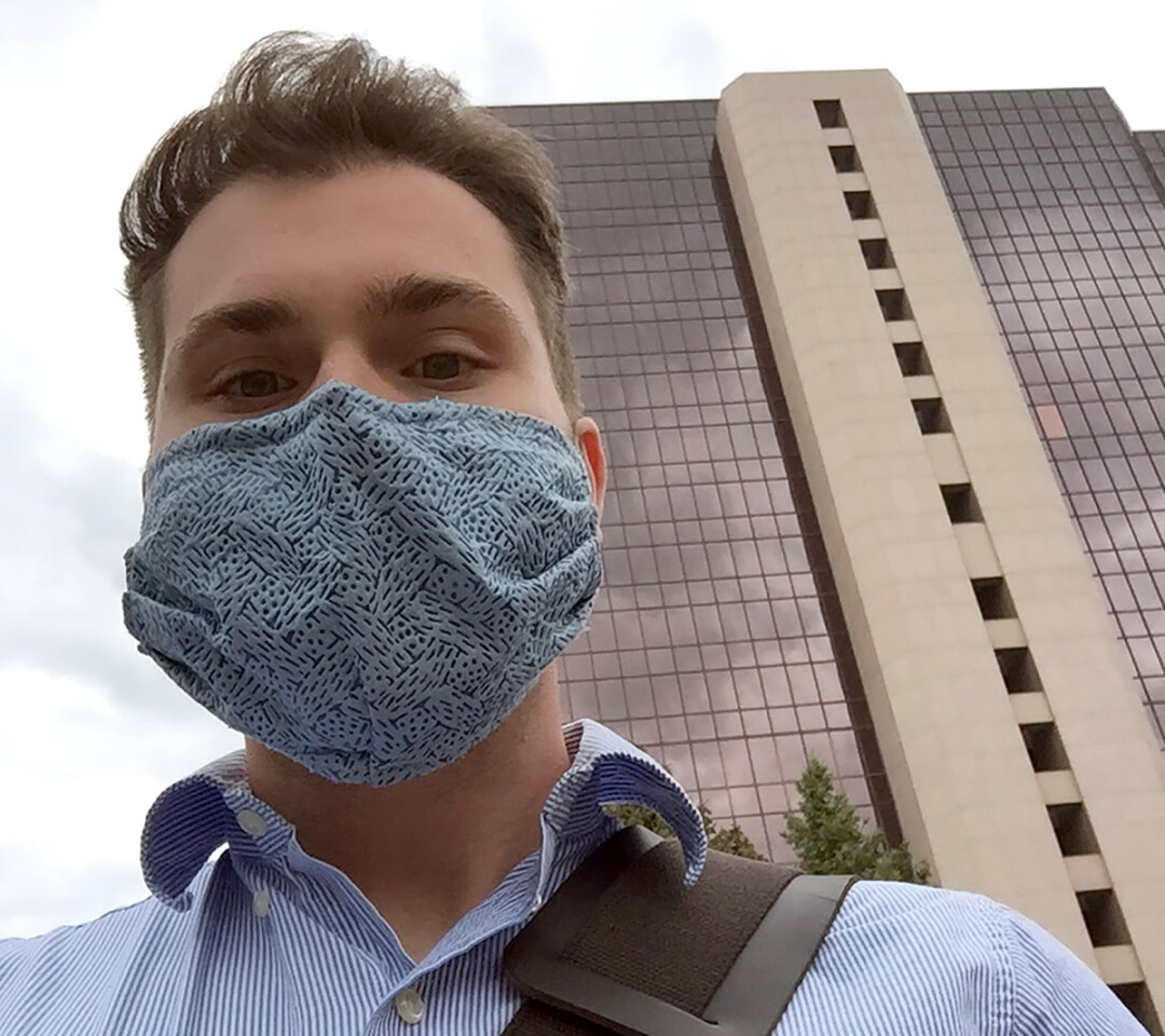 Jack Hemsath wears a protective mask outside Mayo Clinic in Rochester, Minnesota, where he works in the Infectious Diseases Lab.