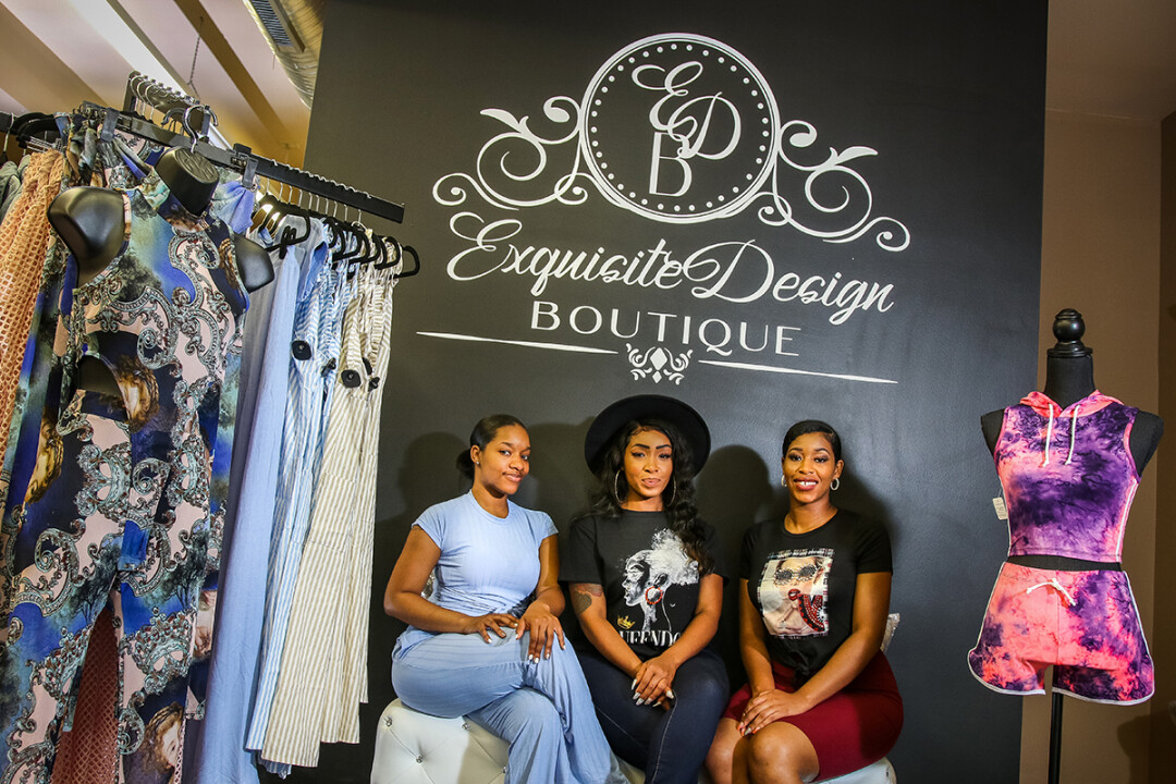 Michelle, Trishell, and Kiazia Lovelace inside their new store, Exquisite Design.