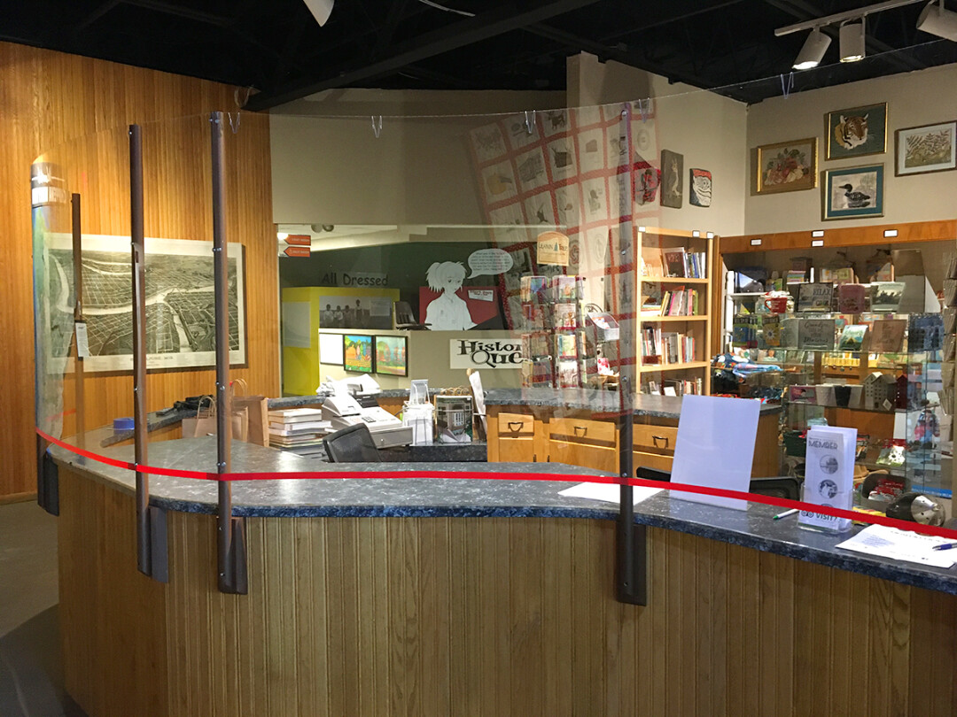 Plexiglass screening has been installed around the museum's front desk.