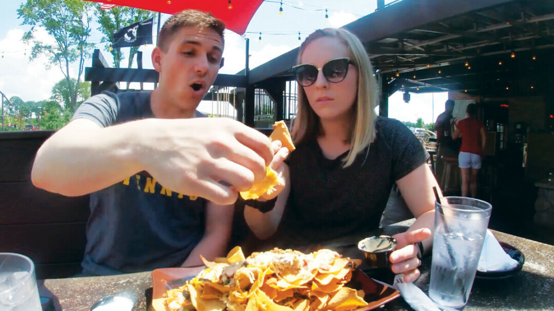 The couple chow down on nachos at Cowboy Jack's in Altoona. (Submitted photo)