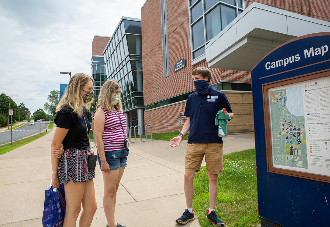 KEEPING IT CLEAN. A UW-Stout Admissions Office guide conducts a tour for new students at UW-Stout earlier this summer. (Submitted Photo)