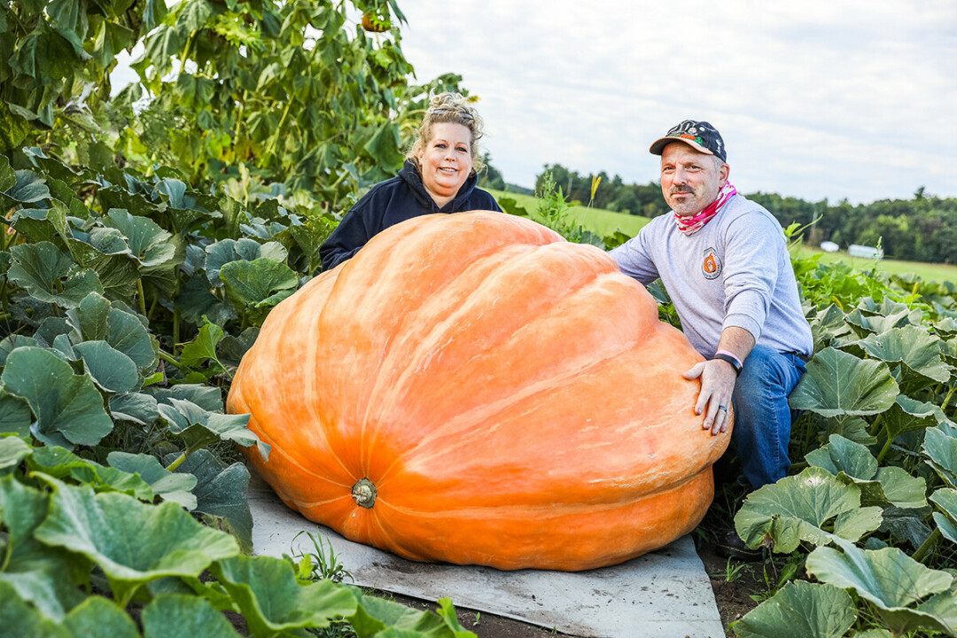 Shannon and Jodi Engel and one of their gargantuan gourds.