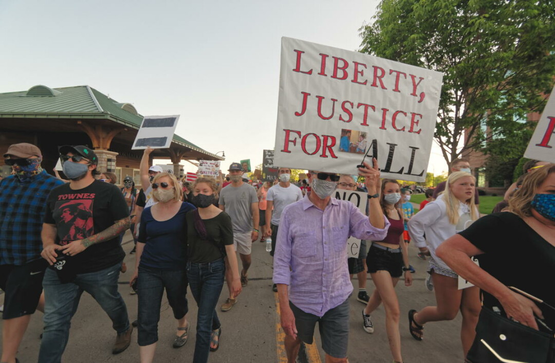 Demonstrators at an Eau Claire protest for racial justice earlier this year following the death of George Floyd while in Minneapolis police custody.