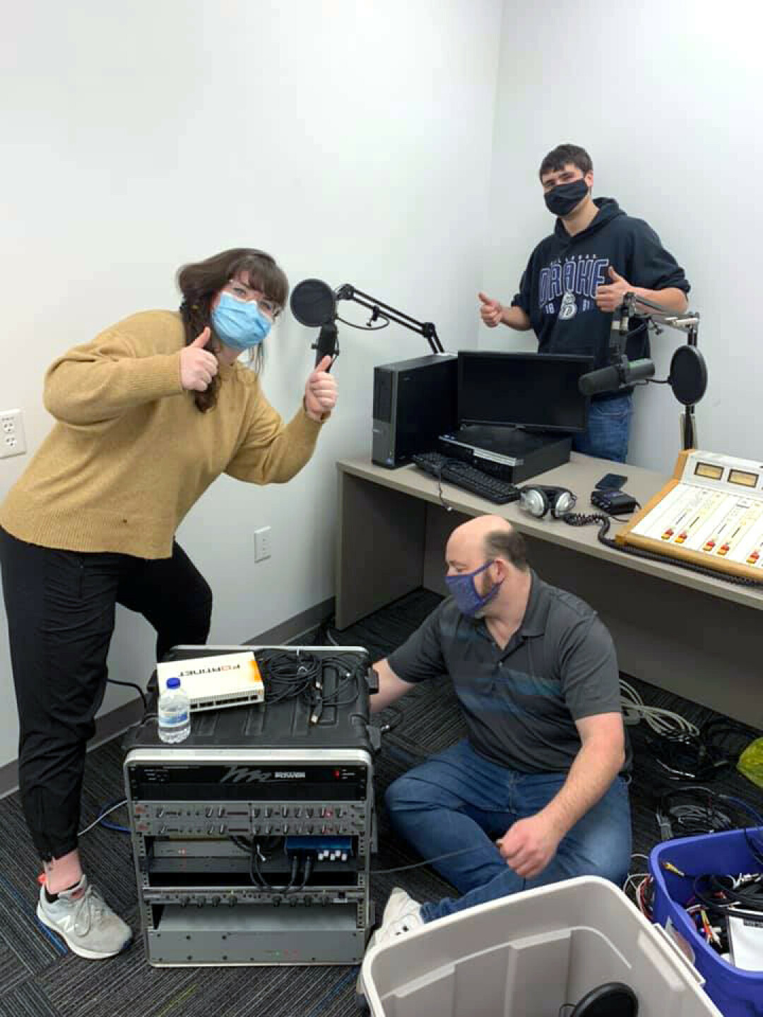 NEW HOME. Station Manager Ashley Wiswell, left, helps set up Converge's new studio inside the Pablo Center at the Confluence. (Photo via Facebook)