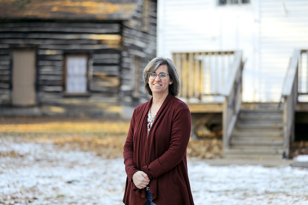 Carrie Ronnander poses outside the Chippewa Valley Museum in Eau Claire's Carson Park. Behind her you can see the