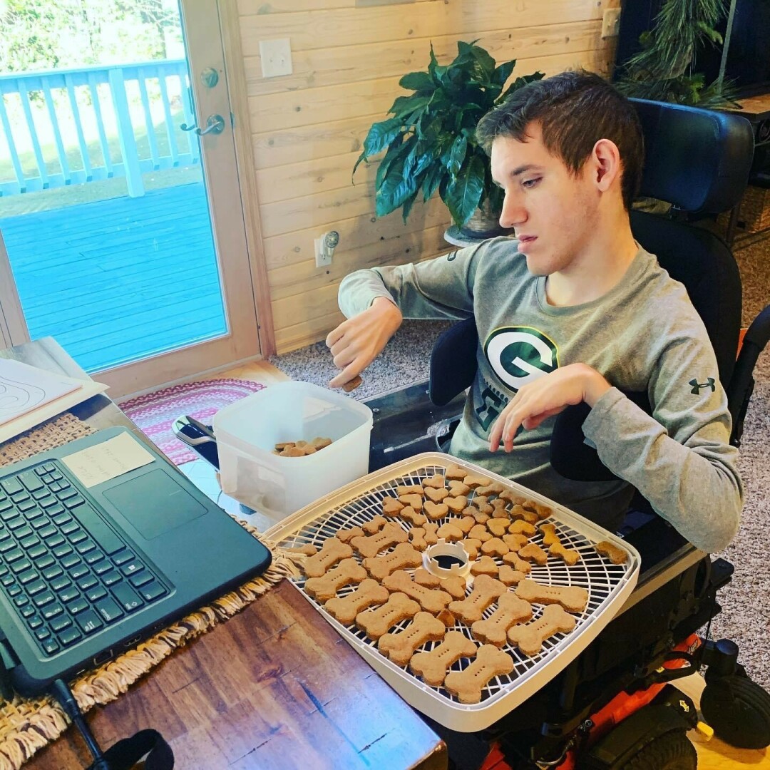 A REAL TREAT. Nick Hinze, the owner of Nick's Dog Treats, created a business that will allow others with disabilities to find work in the future, his mother says. (Submitted photos)