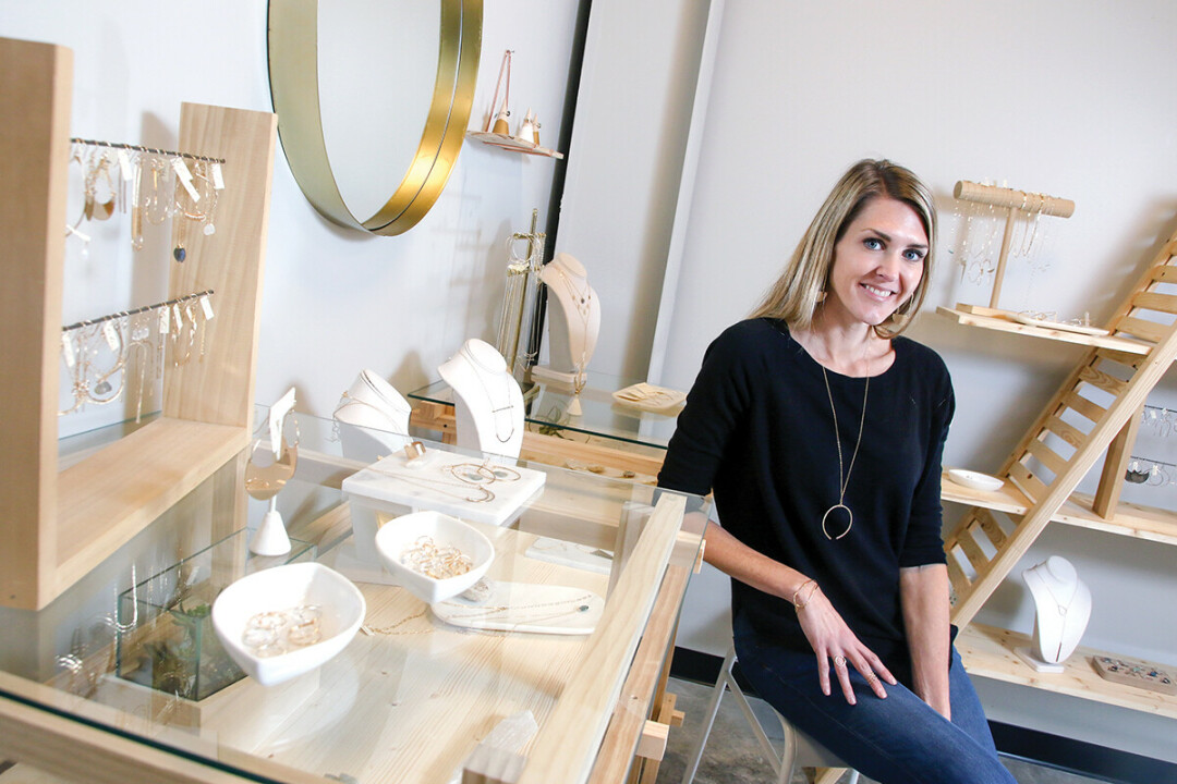 Sarah Wilger – shown at Token Jewelry’s current space at Artisan Forge (above) – has purchased a new home for the business (right) on West Grand Avenue. 