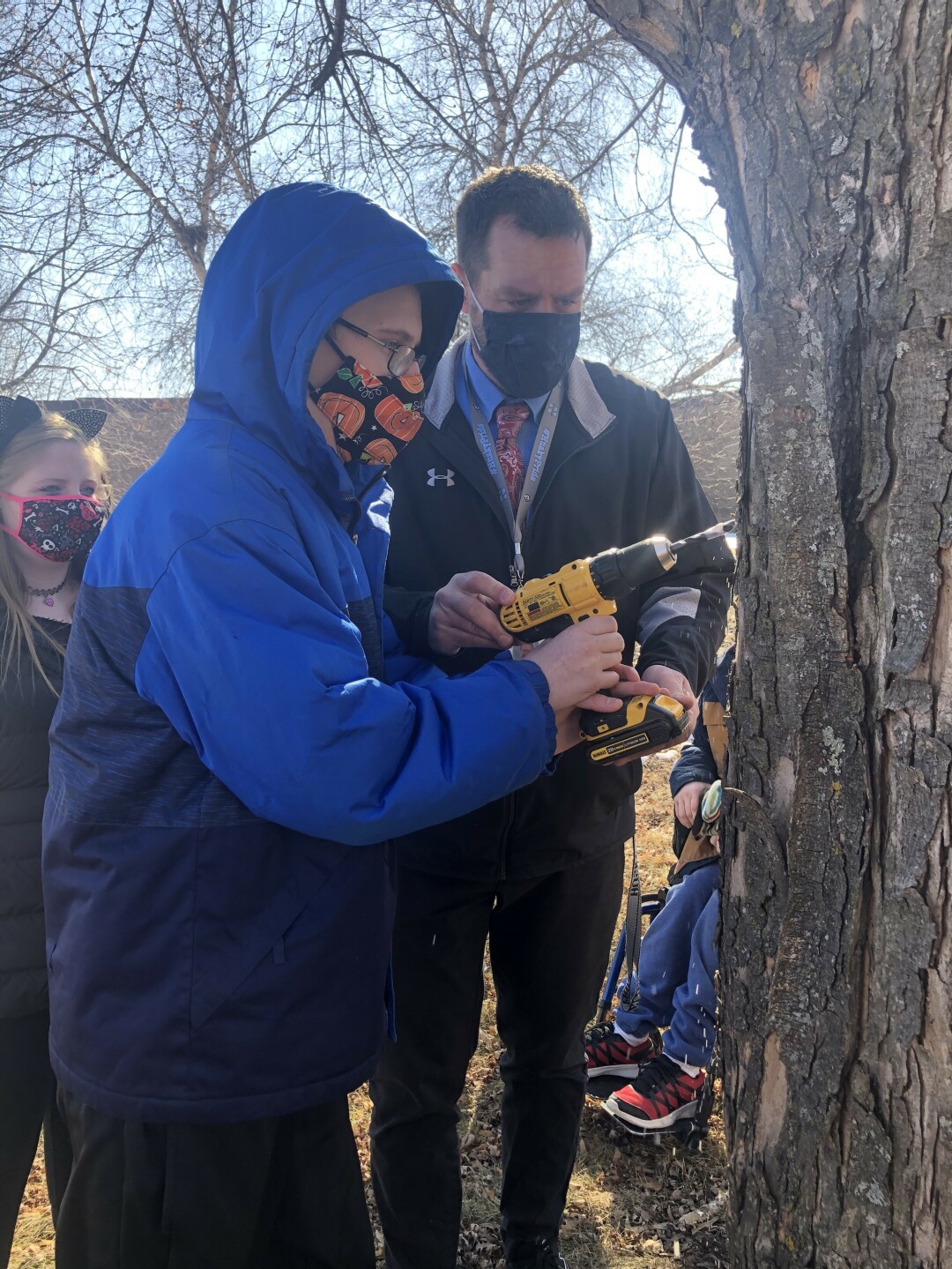 TAP INTO SAP. North High School students worked with Vice Principal Lucas Barth and Missy Cesafsky to make delicious maple syrup.