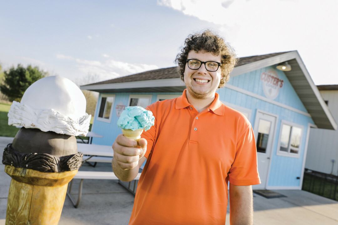 SCOOPS UP. Hunter Custer is ready to scoop at Custer's Cones.