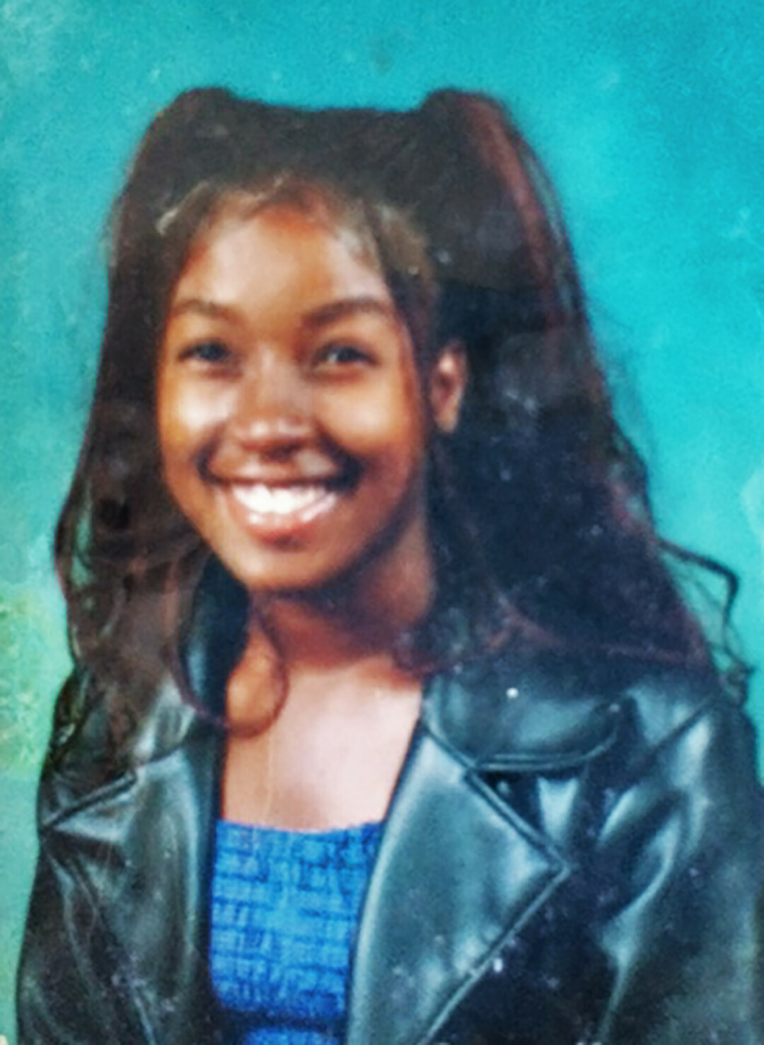 Jeneise Briggs, rocking her signature black leather jacket – a second-hand item she received in high school and wore every day throughout college to stay within her university's conservative dress code. (Submitted photo)
