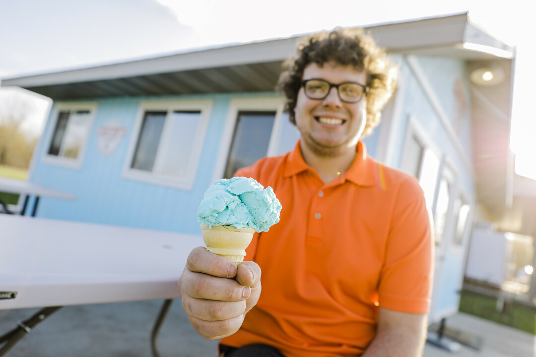 COLORFUL CONES. Though Kellie Williams didn't make it to Custer's Cones, that doesn't mean Custer's Cones is any less good of an ice cream shop! Hunter Custer (pictured above) opened up this sweet shop last year and is excited to serve more exciting treats this summer.