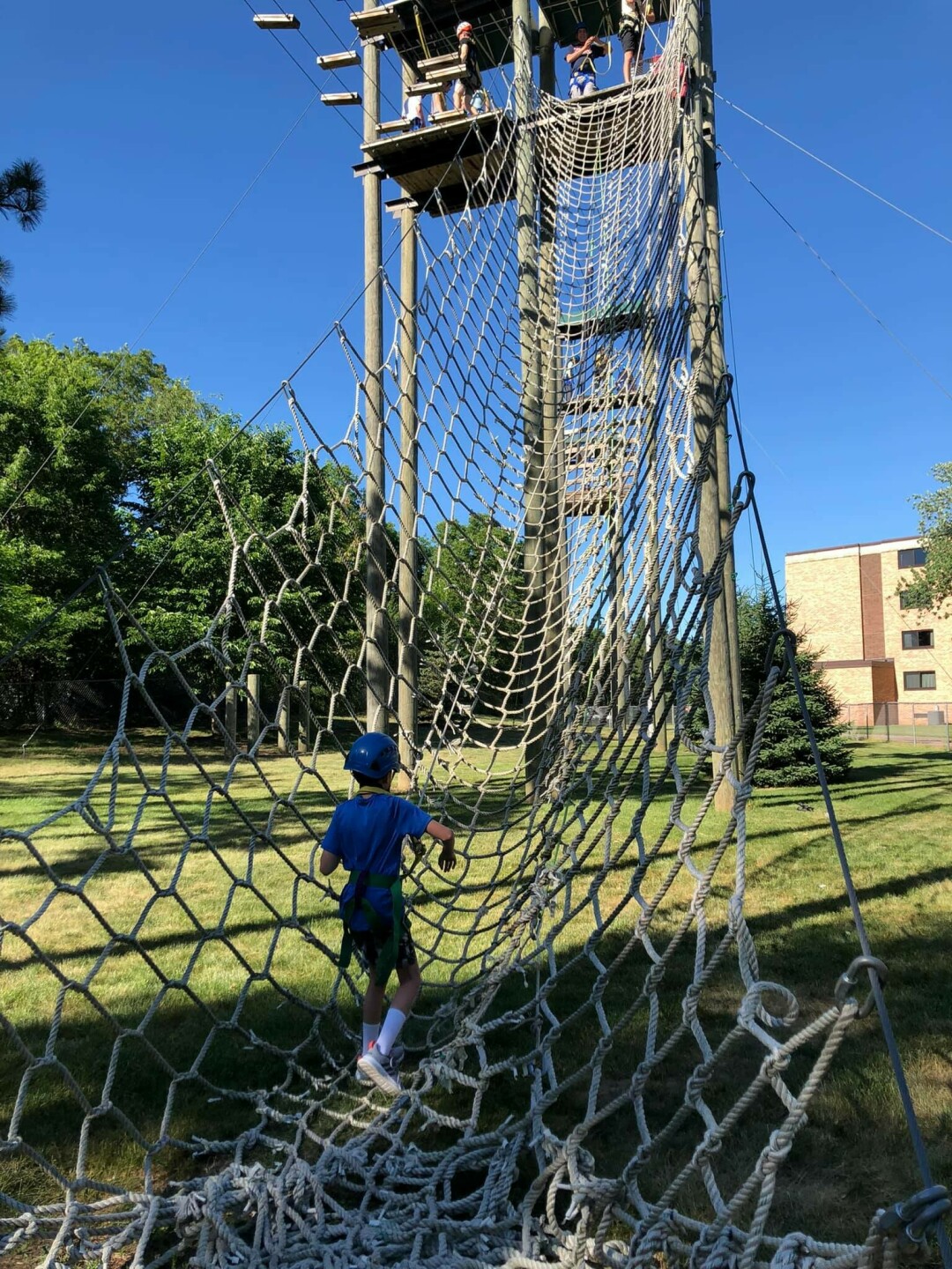CLIMB AMONG THE CLOUDS. The Szymanski family tackled the ropes course this past weekend. Local middle school English teacher Ken Szymanski affirms it's one of the coolest things to do this summer. (Photo by Sarah Szymanski)