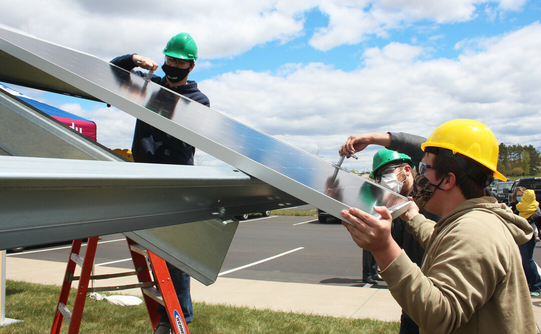 EMERGING ENERGY. CVTC students install solar panels as part of a new system at CVTC’s Energy Education Center.