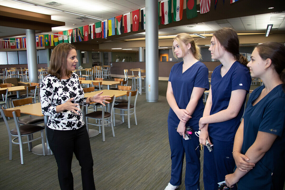 MAKING A POINT. Beaton-Garcia makes it a point to step out of her office to talk with students about their education path. 