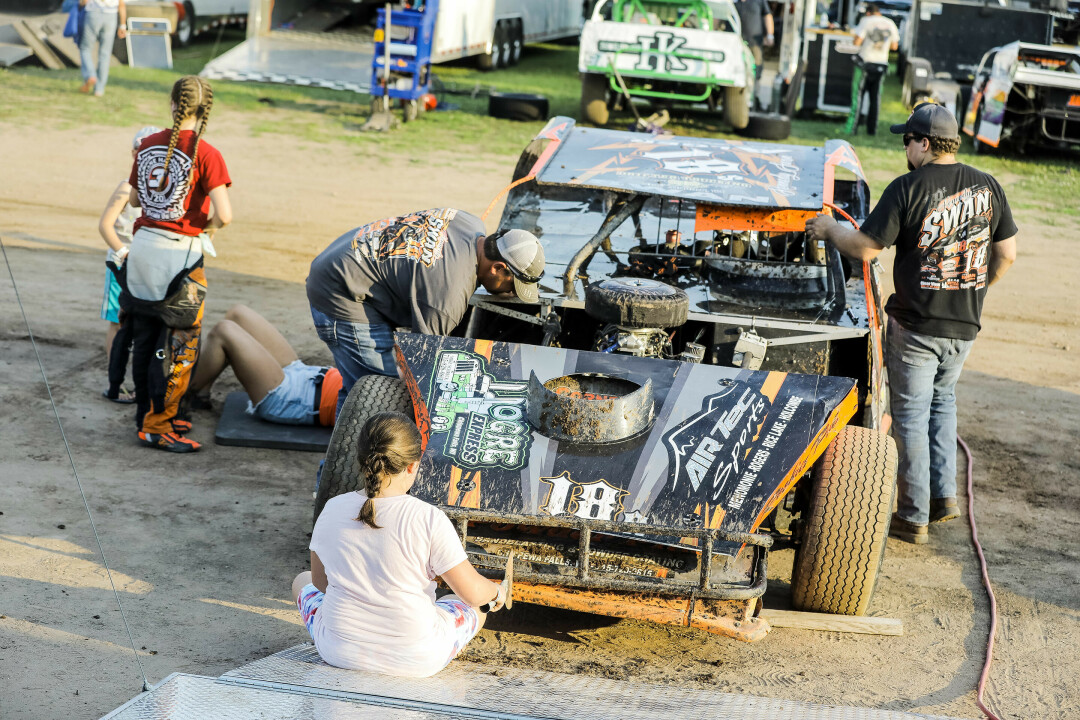TIDYING UP. After racing, Kennedy and her team scrape chunks of mud off her car. When she gets back home, she spends many of her weekday evenings powerwashing the rest of the dirt off to have a fresh start for her next race.