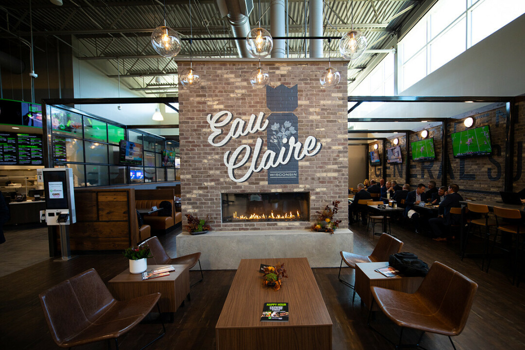 COMING AT THE KING. Shoppers at Eau Claire's new Hy-Vee are greeted by a customized fireplace, complete with a nod to the city's favorite lawn sport: kubb.