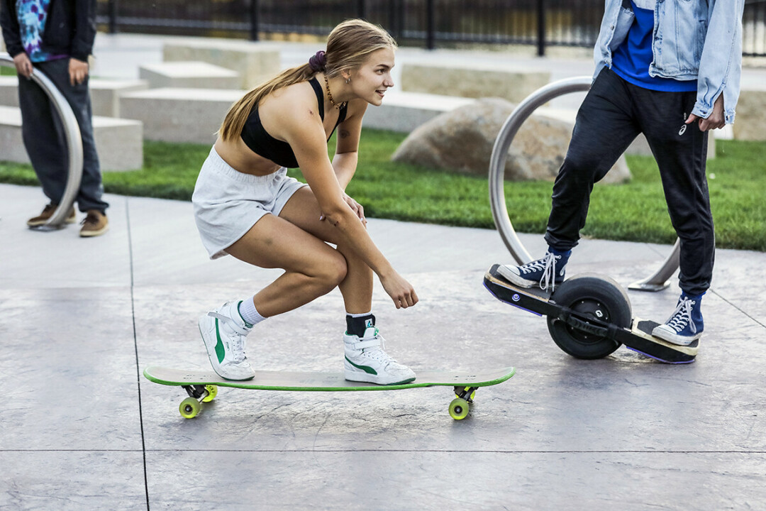 SHE'S WHEELY GOOD. Dani Lehto founder, of UW-Eau Claire's SK8 Club, at Haymarket Plaza in downtown Eau Claire.